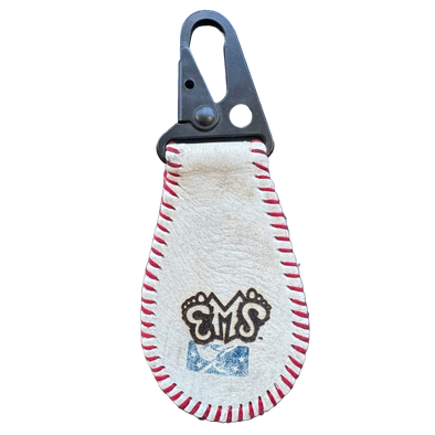 Keychain made from a baseball with a carabiner, featuring a logo on a white background.