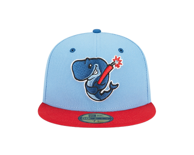 A fitted, baby blue and red cap with an embroidered Exploding Whales mark on the front.