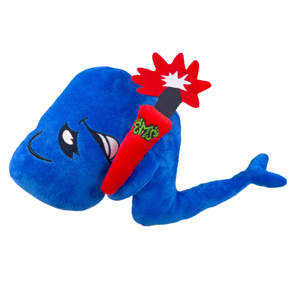 A plush doll of a blue whale with a red dynamite stick in its mouth, featuring a cartoonish design.